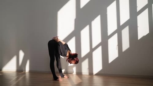 Woman Stretching and Warming Up Indoors