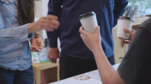 Customers Receive Coffee at Cafe Counter