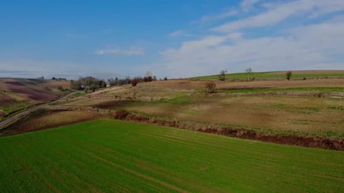 Rolling Hills and Expansive Farmland Aerial View