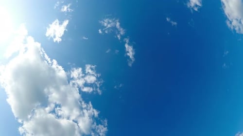 Clouds Move Smoothly in the Blue Sky with Fisheye Effect. Timelapse