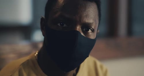 Serious Black Man in Protective Textile Mask
