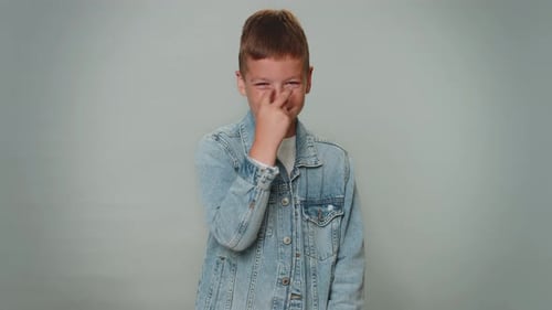 Boy Points and Plays with Fingers Toward Camera