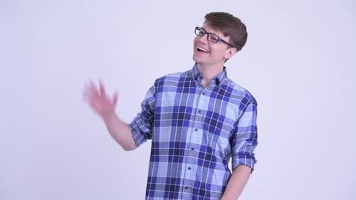 Happy Young Handsome Hipster Man Waving Hand