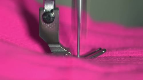 Sewing Machine Stitching Vibrant Pink Fabric Close-Up