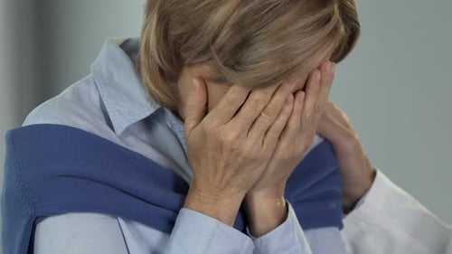 Worried Woman in Doctor's Office Receives Support