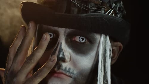 Man with Skull Makeup and Decorative Hat