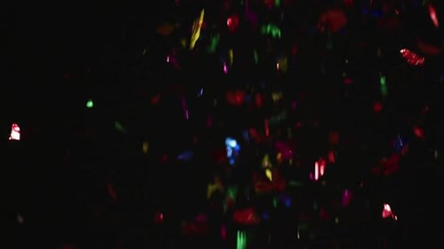 Colorful Confetti Glittering and Falling on Black Background