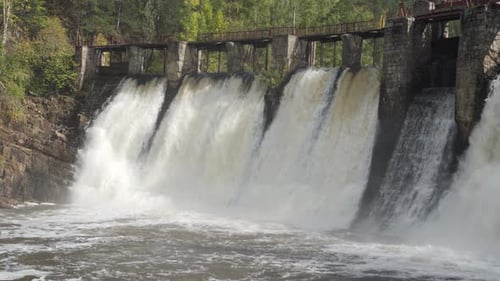 Dam with Flowing Water Through Gates