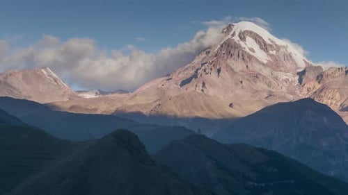 Alpine Landscape View of Kazbek Mountain Covered with Snow, Gorges Ancient Church on Hill