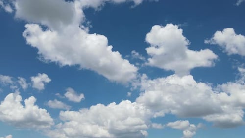 Drifting White Clouds in a Clear Blue Sky