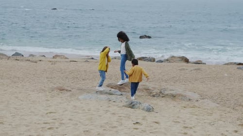 Children Are Playing On Beach