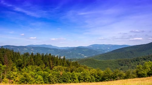 Rolling Green Mountains Landscape on Sunny Day