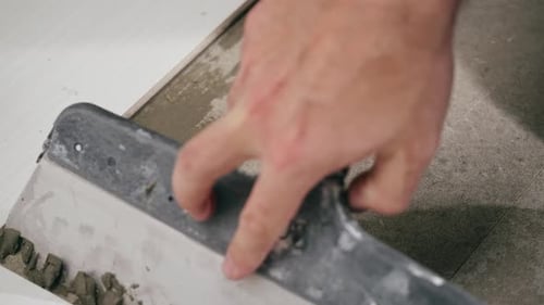 Close Up of Applying Tile Adhesive