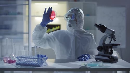 Medical Scientist Looking at Petri Dish