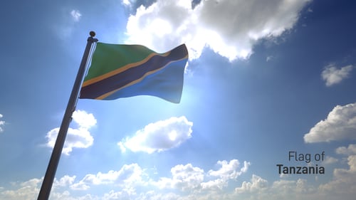 Tanzania National Flag Waving in Bright Blue Sky