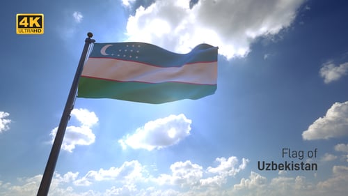 Uzbekistan National Flag Waving in Bright Sunny Sky