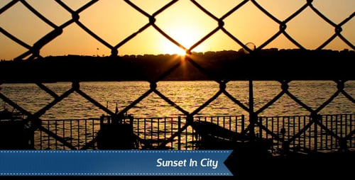 Golden Sunset Over Ocean Waters With Fence