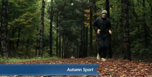 Jogger Runs Along Forest Trail in Autumn
