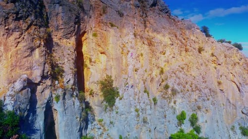 Aerial View of People Climbing in Mountains on a Sunny Summer Day