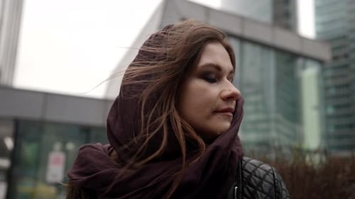 Pretty Young Woman with Scarf on Head is Standing on Street of City at Cold Day Closeup Female
