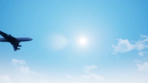 Commercial Airplane Flying Across Blue Sky Loop Animation