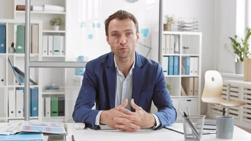 Confident Man Communicating Directly From Office