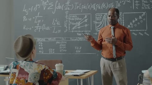 Black Professor Giving Math Lesson to University Students