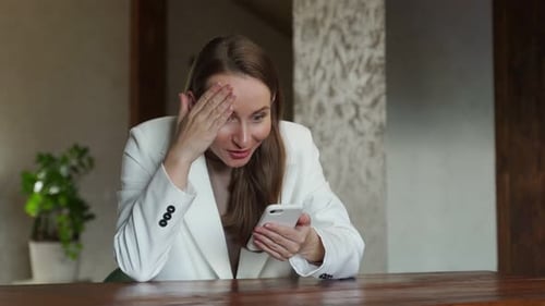 Woman Receives Good News on Mobile Phone