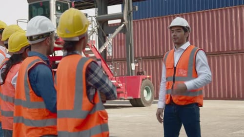 Construction Crew Receives Instructions at Shipping Yard