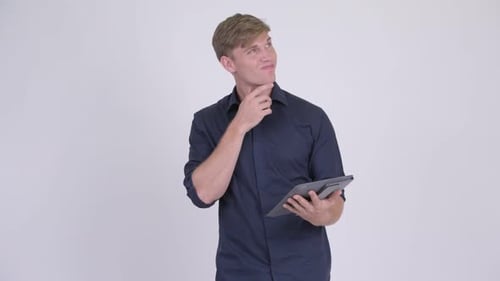 Man Using Tablet Device, Thinking in Studio