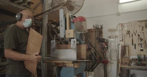 Man with Wood Working in a Shop