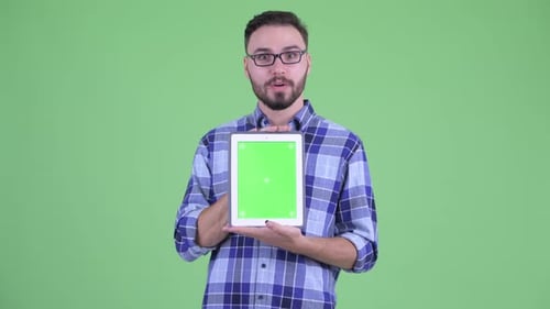 Young Adult Presenting Tablet with Green Screen