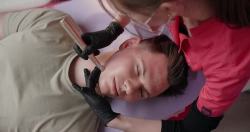 Man Receiving Facial Treatment at Beauty Salon