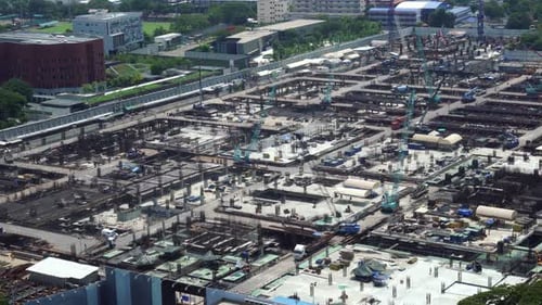 Large Construction Site with Heavy Construction Machinery in Metropolis