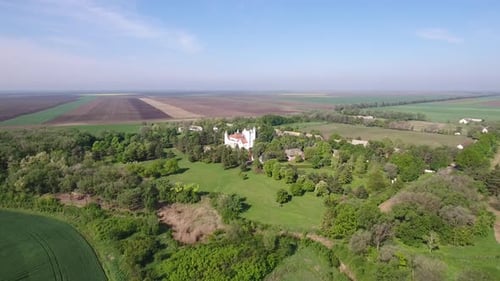 Aerial View of a Picturesque White Castle in Countryside