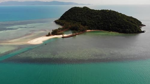 Tropical Island in Sea. Wonderful Drone View of Green Tropical Island in Middle of Calm Blue Sea