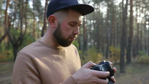 Man with Camera in Forest