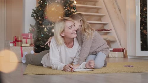 Daughter Whispering in Mothers Ear