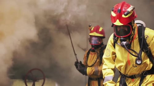 Firefighters Inspect Industrial Equipment in Heavy Smoke