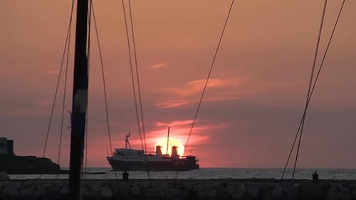 Ship Floating in Sea, Beautiful Red Sun Sitting Down on Horizon, Sea Voyage