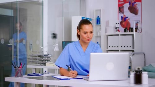 Woman Doctor Working at Desk in Modern Office