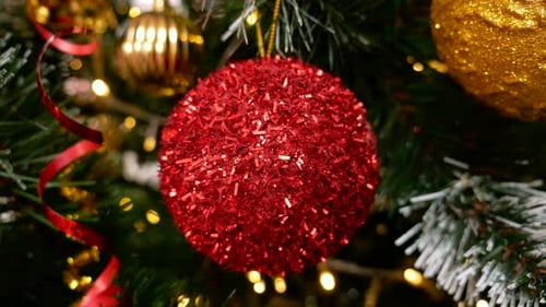 Sparkly Red Christmas Ornament on a Tree