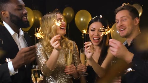 Friends Celebrate With Champagne and Sparklers