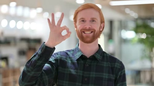Man with Red Hair Gives OK Hand Gesture
