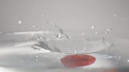 Strawberry Splashing into Water in Slow Motion