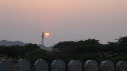 Setting Sun over Rural Landscape