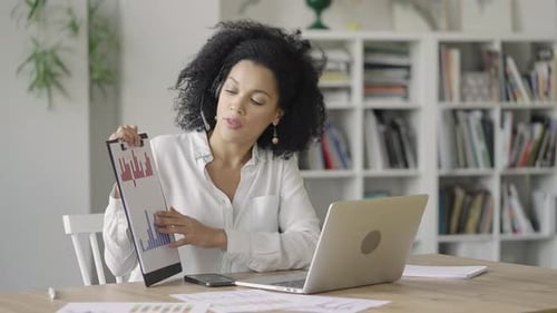 Businesswoman Leading Online Meeting at Home