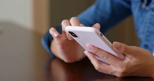 Woman Using Smartphone with White Case Close Up