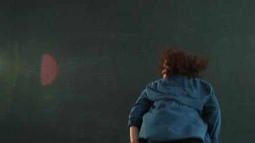 Female Dancer Performing in Studio with Expressive Movements