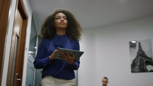 African American Executive Walking Office Looking Corporate Tablet in Company